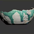 Broken Ceramic Bowl With Green And White Glaze Cracks And Chips
