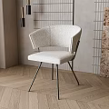 Modern Accent Chair With Curved Backrest And Metal Legs In Herringbone Wood Floor Interior