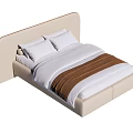 Modern Double Bed With Beige Headboard White Pillows And Brown Blanket