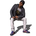 Casual Man in Gray Hoodie White T-shirt and White Pants Sitting with Blue Sneakers