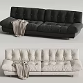 Black and Cream Two-Seater Sofa with Plush Cushioned Design and Throw Blanket