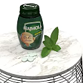 Medical Device Green Bottle With White Tablets And Fresh Leaves On Marble Table