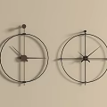 Two Circular Metal Frame Wall Mounted Clocks With Minimalist Dials On Light Colored Wall