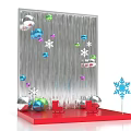 Festive Holiday Decoration Display With Silver Backdrop Colorful Ornaments Snowflakes And Red Base