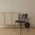 Stylish Dining Chair With Woven Panel Cabinet And Black Vase On Wooden Floor