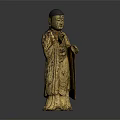 Golden Standing Buddha Statue With Robed Figure And Raised Hand Gesture In Traditional Decorative Design
