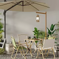 Outdoor Table and Chair Set with Umbrella and Green Plants in Natural Setting