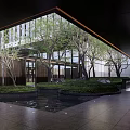 Modern Courtyard Garden With Glass Curtain Wall Trees Pond Greenery And Stones