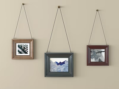 Three Framed Paintings Hanging On Light Colored Wall With Different Artworks 3d model