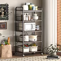 Multi tiered Rolling Shelf With Microwave Bowls Storage Boxes And Kitchen Items In Indoor Space