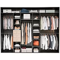 Organized Wardrobe Interior With Hanging Clothes Folded Garments Drawers Storage Boxes And Shoes