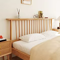 Wooden Double Bed Interior With Slatted Headboard White Pillows Floral Blanket And Bedside Tables