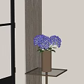 Metal Vase With Blue Hydrangeas On Gold Metal Side Table By Window