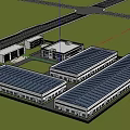 Modern Industrial Factory Complex With Large Workshop Buildings Surrounded By Greenery And Road Access