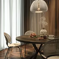 Round Wooden Dining Table Set With Woven Chairs Pendant Light Wooden Wall And Curtains
