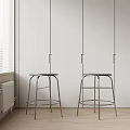 Modern Minimalist Bar Stools With Metallic Frame And Round Seats In White Room