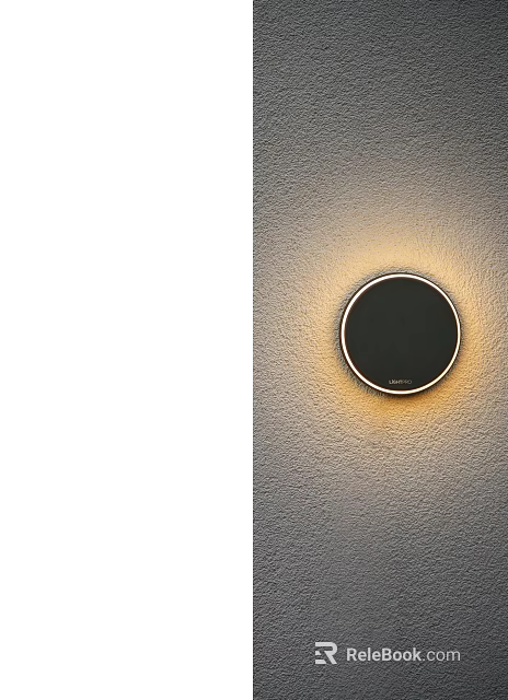 Modern Circular Black Wall Lamp With Warm Light Mounted On Textured Wall 3d model 