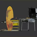 Outdoor Grilling Setup With Portable Grill Yellow Cart Wooden Round Table And Surfboard