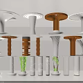Various Designed Columns in White and Brown with Patterns Top Decorations and Green Plants