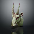 Green Fantasy Creature Head Sculpture With Red Spiral Horns And Purple Red Stripes