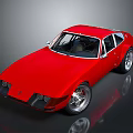 Red Classic Sports Car With Sleek Body Black Windows And Silver Wheels