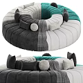 Modern Circular Sectional Sofa With Gray White Teal Plush Cushions And Throw Blanket