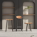 Three Modern Bar Stools With Brown Seats Black Legs And Wooden Shelves Background