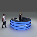 Blue Circular Information Desk With Two People Standing Nearby