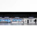 Modern Airport Check in Area With Digital Information Screens And Self Service Kiosks