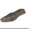 Natural Gray Brown Stone With Irregular Shape Textured Surface And Rough Details On Black Background