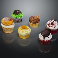 Assorted Decorated Cupcakes With Various Toppings And Flavors On Black Surface