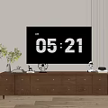 Wooden TV Stand With Drawers And Decorations Near Potted Plant On Striped Wall