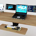 Ergonomic Laptop Workstation Setup With Multiple Monitors and Keyboard On Wooden Desk