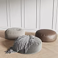 Stylish Round Gray Brown Fabric Leather Ottomans With Textured Blanket On Wooden Floor Minimalist Setting