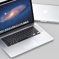Sleek Apple Laptop Open Screen Showing Galaxy Display With Silver Body And Desktop Icons