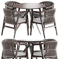 Modern Round Wooden Table With Four Woven Back Chairs And Gray Cushions Metal Legs