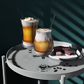 Layered Iced Coffee Drinks With Cream Topping Straws On Tray Coffee Beans And Chocolate Pieces