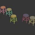 Five Different Colored Wooden Stools In Orange Light Brown Blue And White