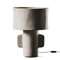 Modern Table Lamp with Textured Beige Fabric Shade and Sculptural Humanoid Base Emit Warm Glow