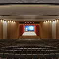 Modern Conference Room With Stage Large Screen Red Curtains And Arranged Seats