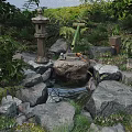 Traditional Japanese Garden Scene With Stone Lantern Flowing Water Rocks And Green Plants
