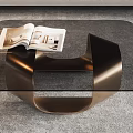 Elegant Modern Coffee Table With Glass Top Bronze Frame And Open Magazines In Living Room
