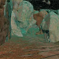 Natural Cave Interior With Rough Stone Walls Large Rocks And Sandy Ground