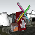 Colorful Windmill Blades And Tower Structure With Village Houses And Trees