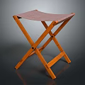 Wooden Folding Stool With Brown Fabric Seat And X Shaped Legs