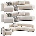 Modern Curved Light Colored Sectional Sofa Upholstered With Throw Pillows And Blanket