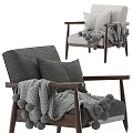Cozy Gray Armchair With Wooden Frame Pillows And Pom Pom Blanket
