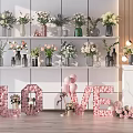 Colorful Flowers In Different Style Vases Display On Shelves With LOVE Letters