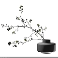 White Vase With Decorative Branches Green Leaves And Small White Flowers