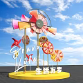 Colorful Windmill Sculpture with Long Live Life Lettering and Blue Sky